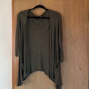 Olive green pocket cardigan with buttons. New condition. Half length sleeves